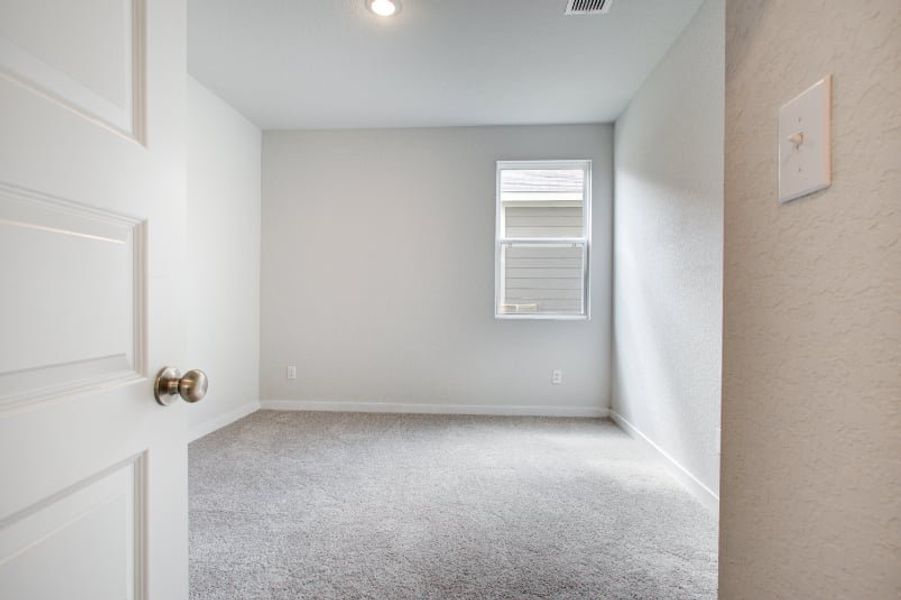 A hallway with white doors. A hallway with white doors.