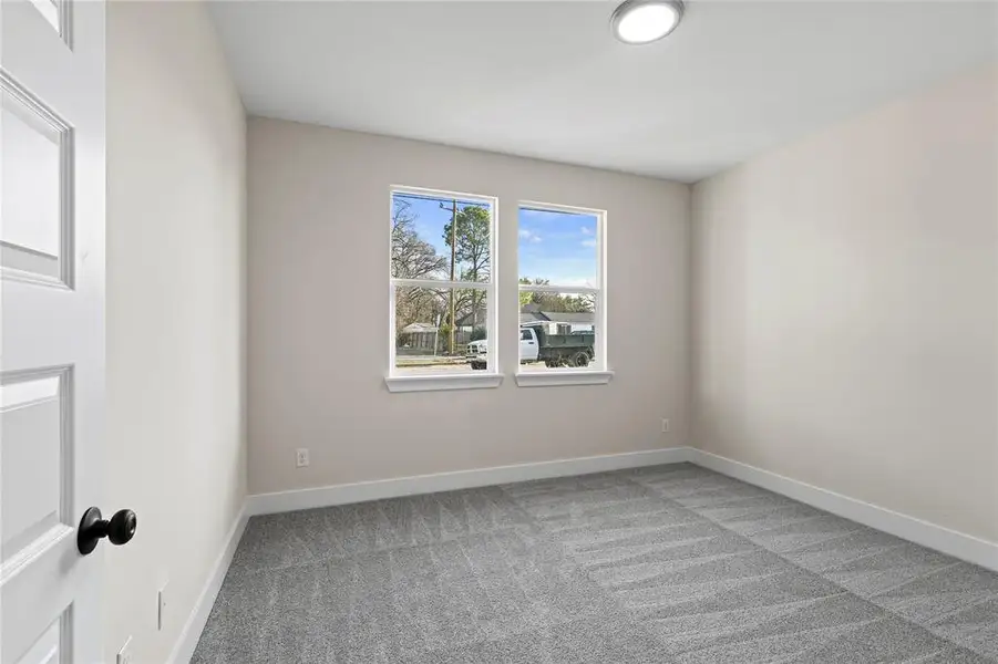 Empty room with carpet floors