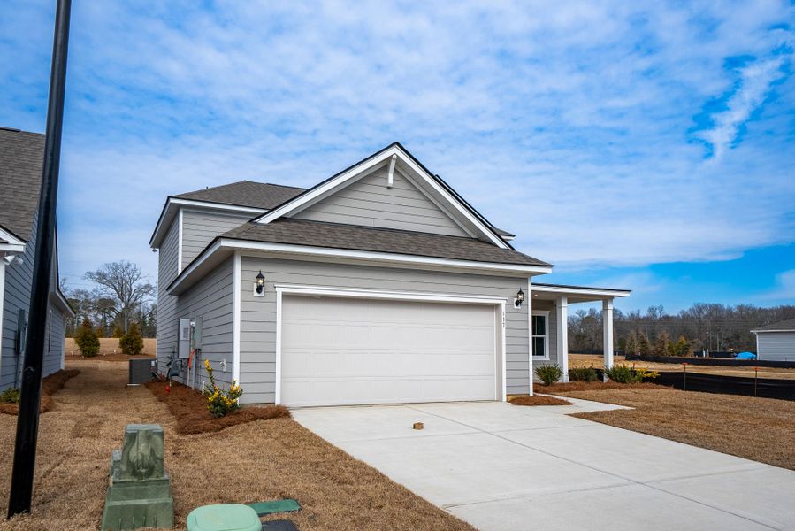 Front exterior of a new home in Monroe Preserve, Chapin, SC, highlighting curb appeal (Image 26).