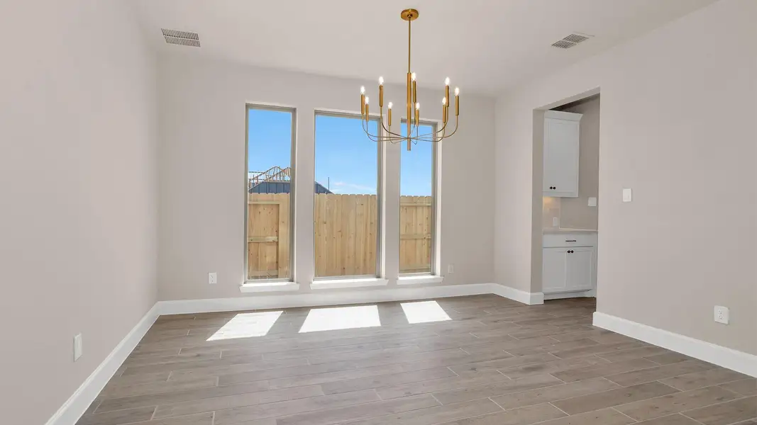 Spacious, unfurnished interior of a new home in Legacy Prairie at Katy Court, Katy (Image 9).