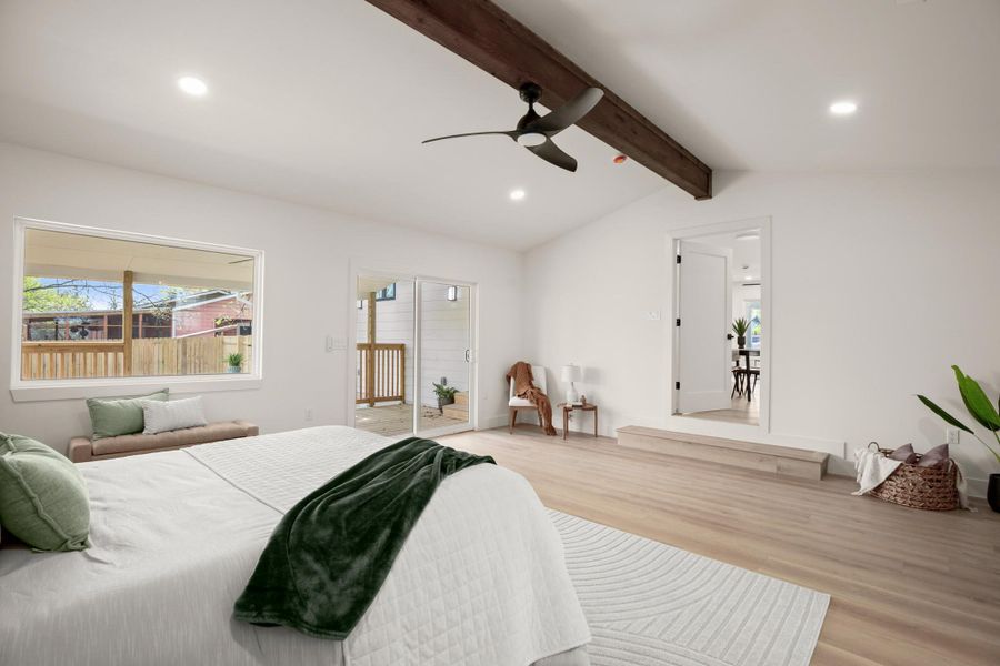 Bedroom featuring recessed lighting, vaulted ceiling with beams, wood finished floors, access to exterior, and a ceiling fan