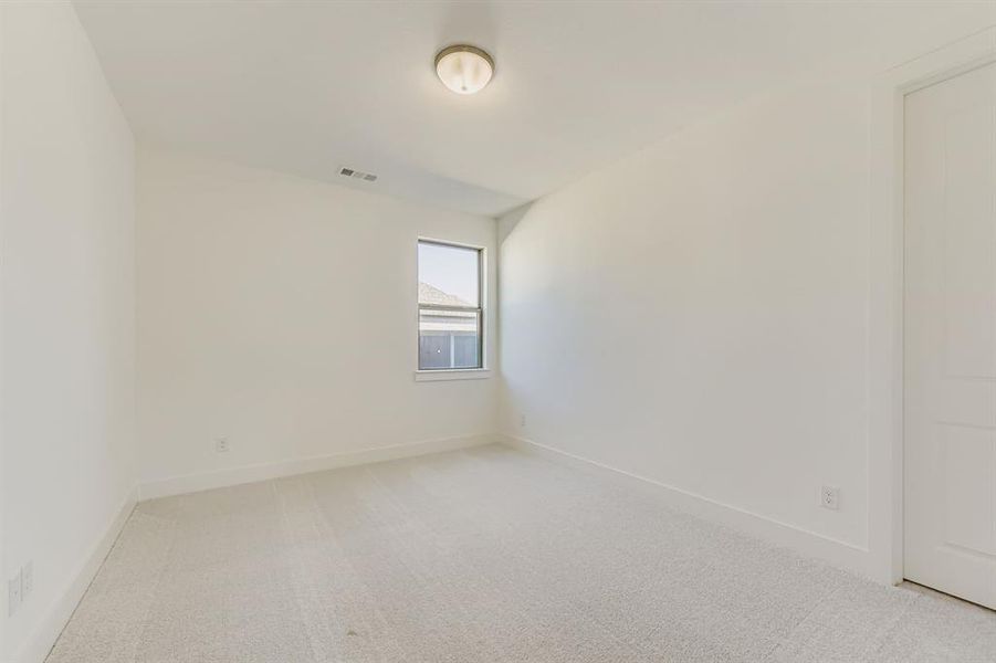 Empty room featuring baseboards and light carpet Empty room featuring baseboards and light carpet