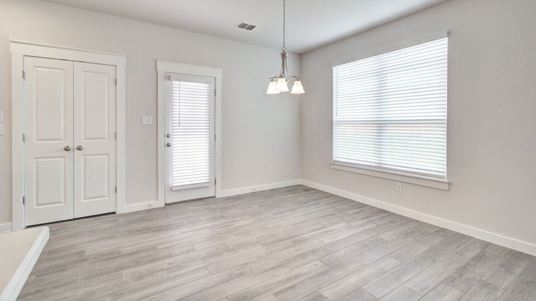 Representative furnished interior of a home built from the Majestic by Brightland Homes in Sunterra, Katy (Image 9).