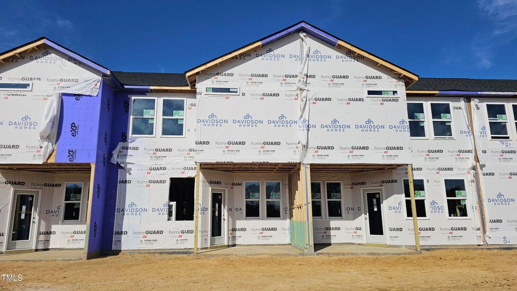 Front exterior of a new home in Springvale, Fuquay Varina, NC, highlighting curb appeal (Image 54).