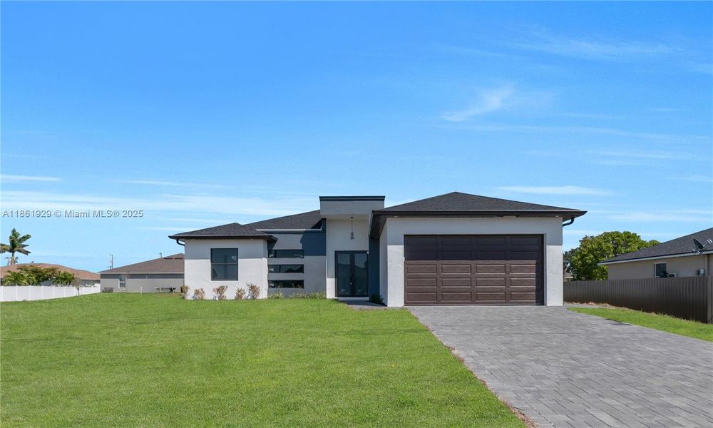 Front exterior of a new home in , Cape Coral, FL, highlighting curb appeal (Image 12). Front exterior of a new home in , Cape Coral, FL, highlighting curb appeal (Image 12).