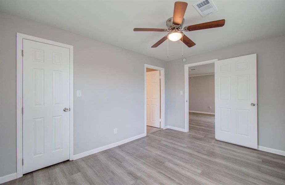 Fourth bedroom upgraded with ceiling fan with LED lighting