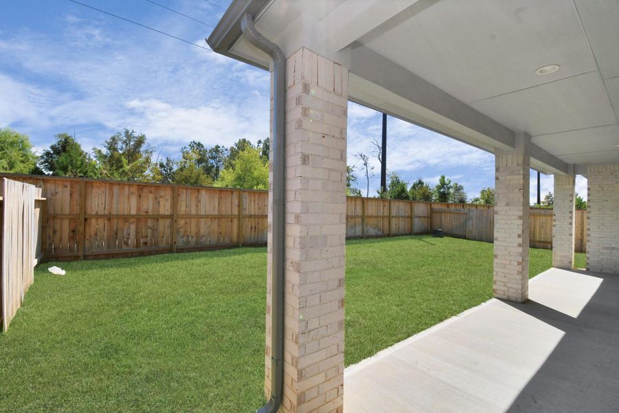 Experience outdoor living at its finest on this expansive covered patio, thoughtfully designed for BBQs and delightful outdoor dining