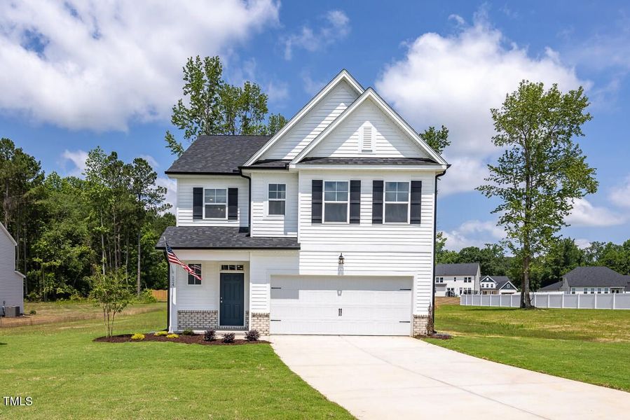 Front exterior of a new home in Wellers Knoll, Lillington, NC, highlighting curb appeal (Image 22).