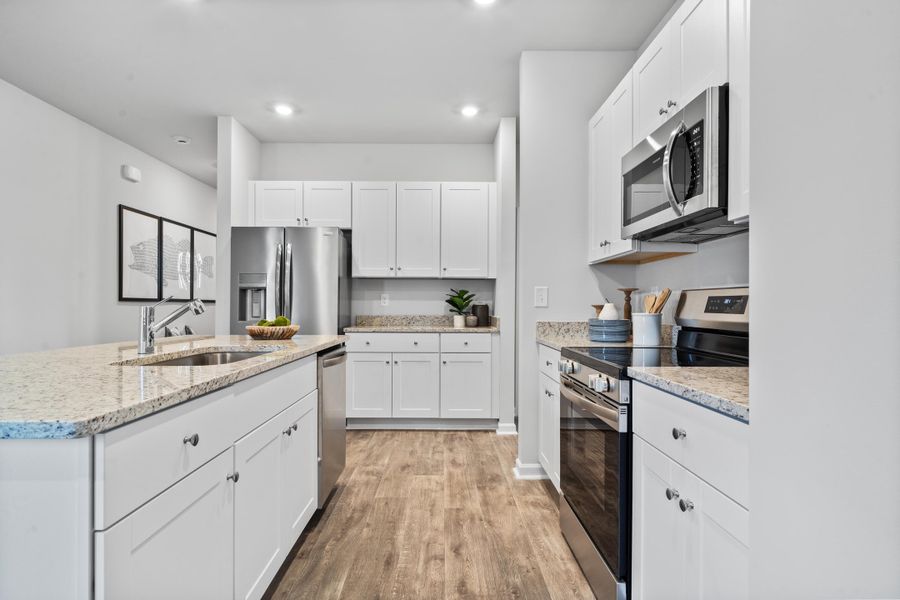 Furnished interior in a model home at Lindera Preserve at Cane Bay Plantation: American Dream Series - Ph 15 in Summerville (Image 26).