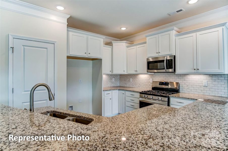 Kitchen will feature quartz counters and white cabinets Kitchen will feature quartz counters and white cabinets