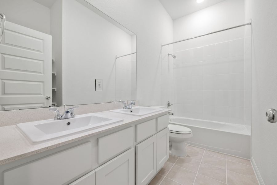 Bathroom in the Quartz home plan by Trophy Signature Homes – REPRESENTATIVE PHOTO