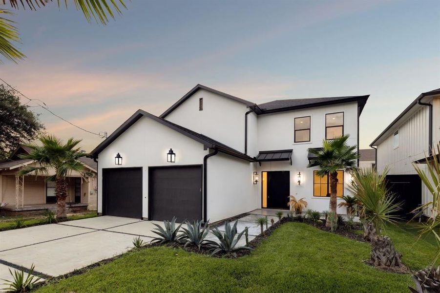 Contemporary house with a garage and a yard