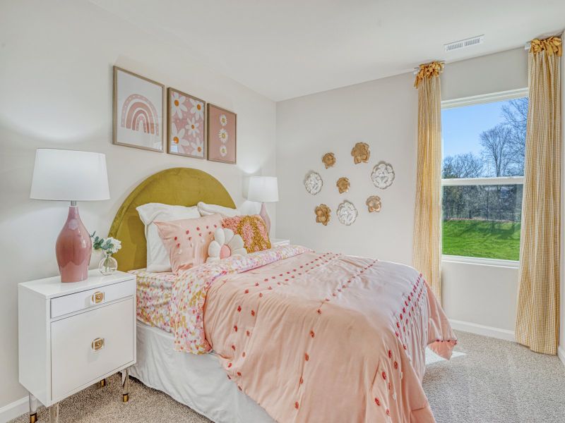 Secondary bedroom in the Amber floorplan at a Meritage Homes community in Graham, NC.