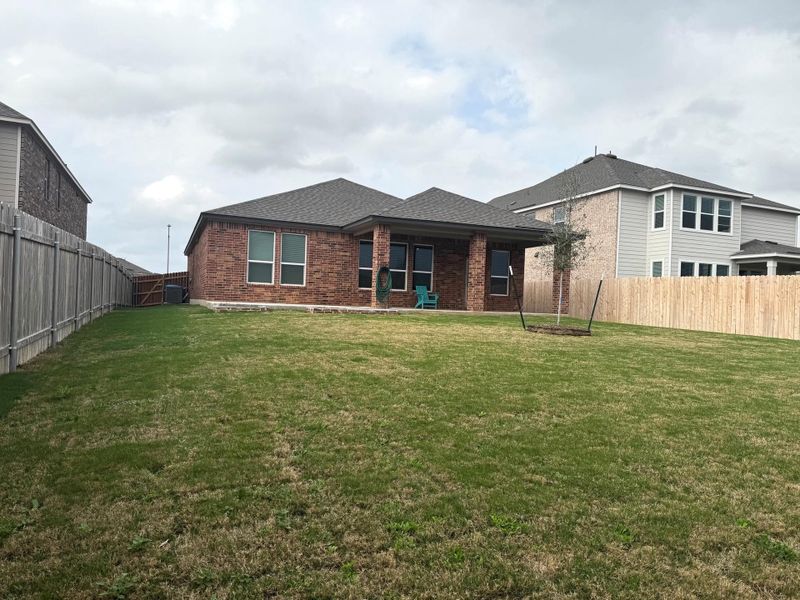 Huge backyard. View of all brick of the house