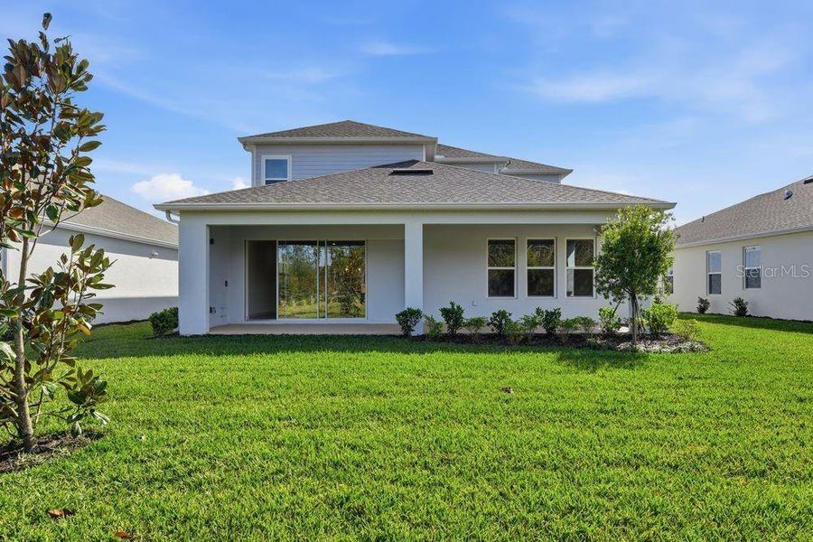 Exterior details and patio area of a home in Ardisia Park, New Smyrna Beach (Image 3).
