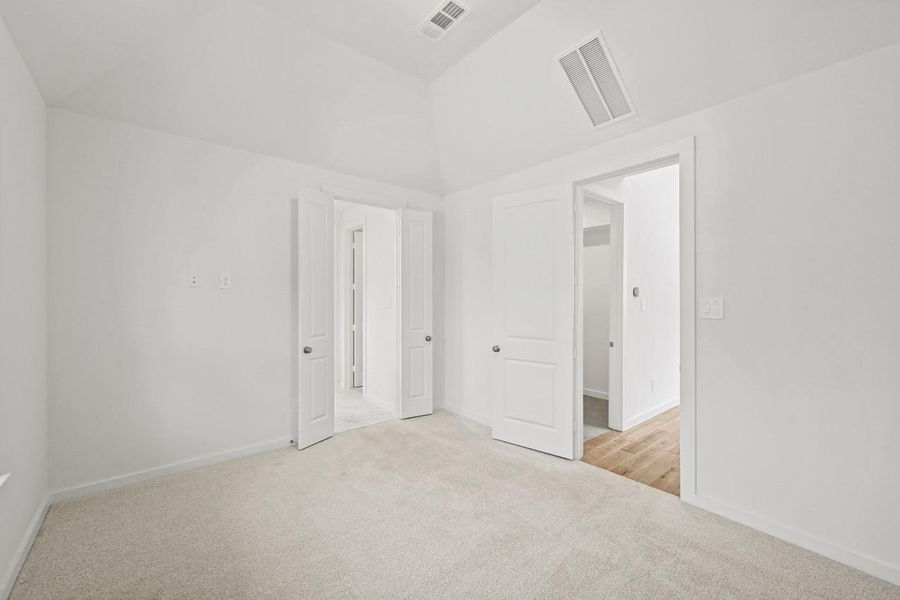 The primary bedroom includes elegant French doors that lead directly to the bathroom, adding both style and seamless convenience. The primary bedroom includes elegant French doors that lead directly to the bathroom, adding both style and seamless convenience.