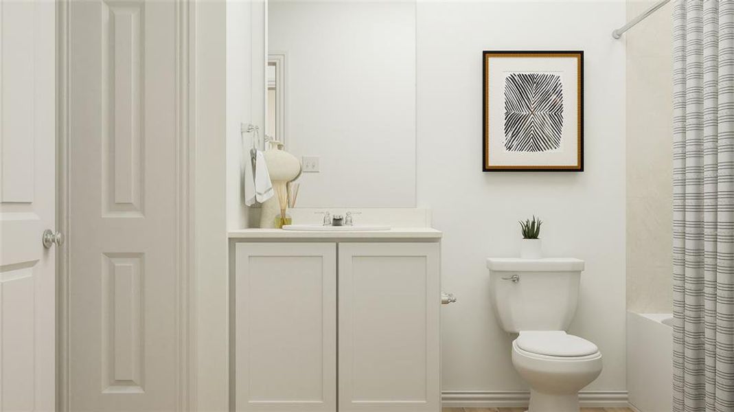 Full bathroom with vanity, toilet, and shower / bath combo with shower curtain