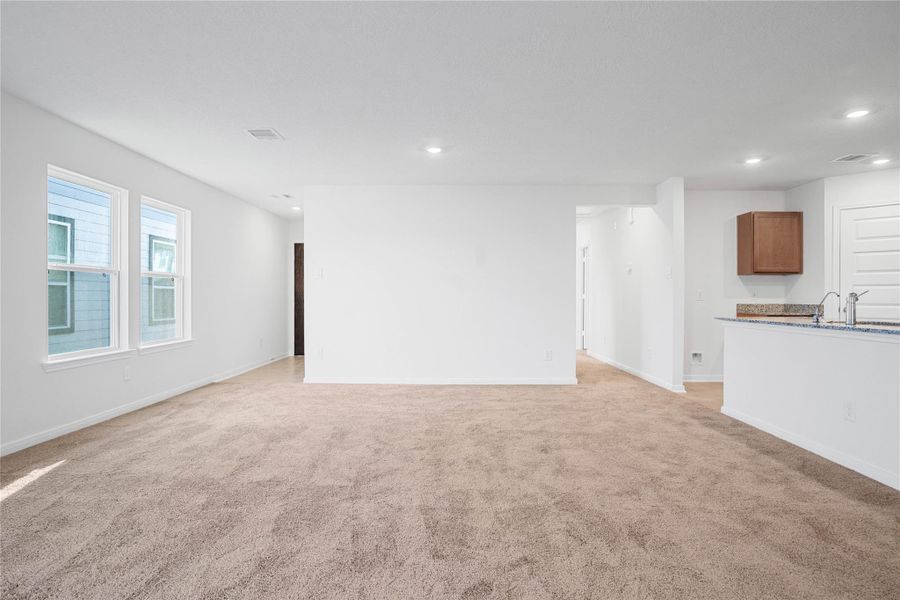 Create lasting memories with family and friends in this inviting dining room! It showcases high ceilings, recessed lighting, custom paint, and stunning plush carpet flooring. Create lasting memories with family and friends in this inviting dining room! It showcases high ceilings, recessed lighting, custom paint, and stunning plush carpet flooring.