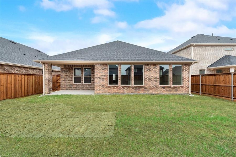 Exterior details and patio area of a home in Spiritas Ranch, Little Elm (Image 3).