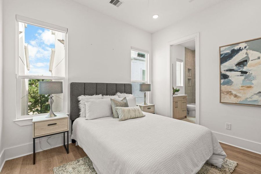 Rather than treating secondary bedrooms as an afterthought, the design affords each its own sense of presence. Natural light, private bath access, and a consistent architectural vocabulary create spaces that feel welcoming, comfortable, and complete.
