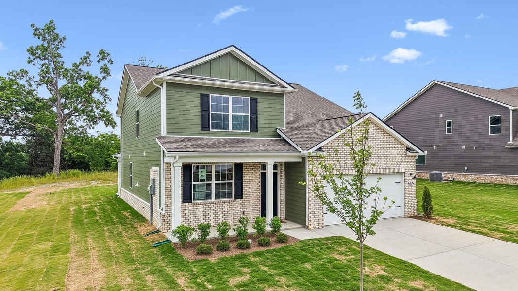 Front exterior of a new home in Pottsview, Smyrna, TN, highlighting curb appeal (Image 2). Front exterior of a new home in Pottsview, Smyrna, TN, highlighting curb appeal (Image 2).