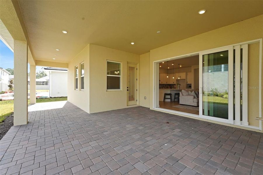 Exterior details and patio area of a home in Palms at Windermere, Windermere (Image 25).