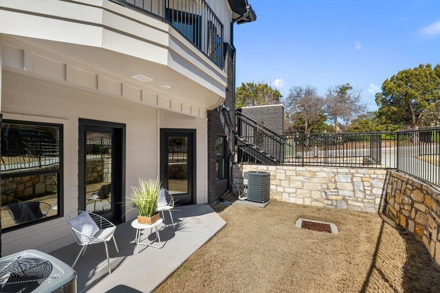 Patio / terrace featuring a patio and stairway