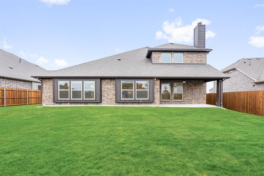 Exterior details and patio area of a home in Villages of Hurricane Creek, Anna (Image 26).