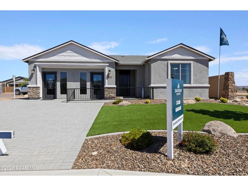 Front exterior of a new home in North Ridge at Pronghorn Ranch, Prescott Valley, AZ, highlighting curb appeal (Image 1). Front exterior of a new home in North Ridge at Pronghorn Ranch, Prescott Valley, AZ, highlighting curb appeal (Image 1).