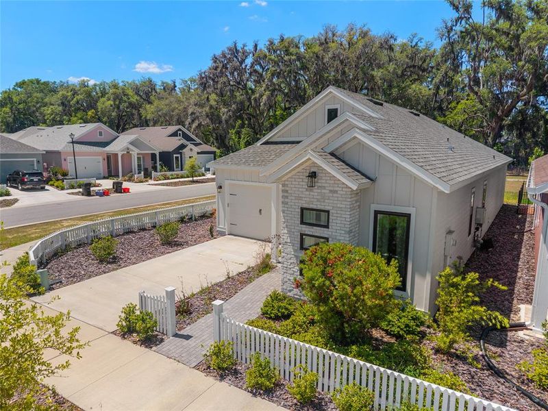 Front exterior of a new home in Fairway Pointe at West End, Newberry, FL, highlighting curb appeal (Image 28).