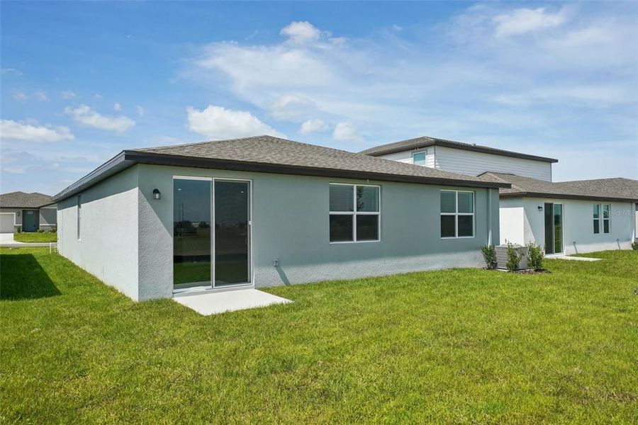 Front exterior of a new home in Benton Hills - Classic Series, Brooksville, FL, highlighting curb appeal (Image 17). Front exterior of a new home in Benton Hills - Classic Series, Brooksville, FL, highlighting curb appeal (Image 17).