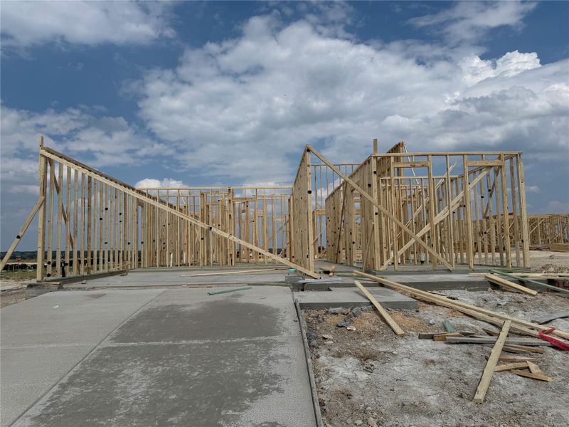 Front exterior of a new home in Lariat: 50ft. lots, Liberty Hill, TX, highlighting curb appeal (Image 1).