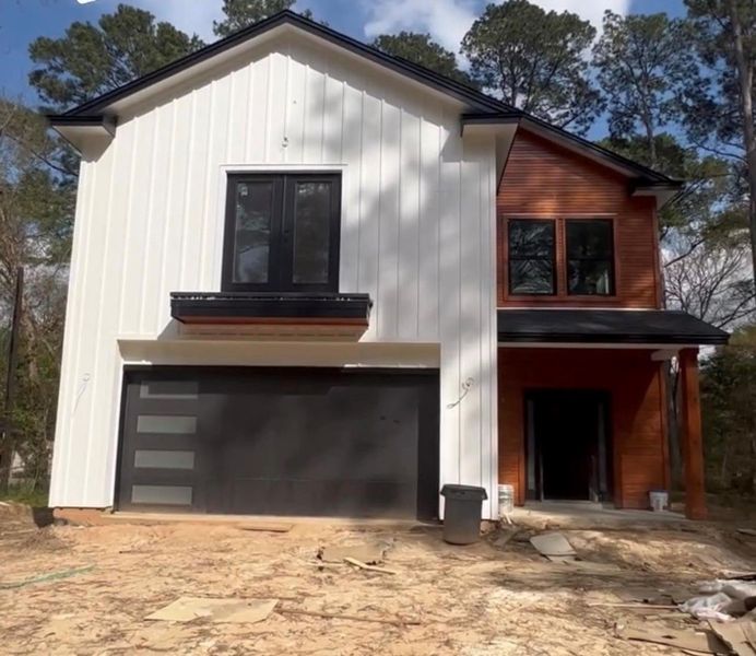 Front exterior of a new home in , Conroe, TX, highlighting curb appeal (Image 4).