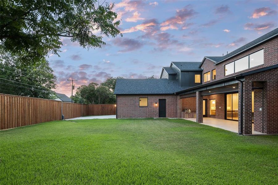 Yard at dusk with a patio