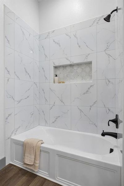 This primary bathroom also includes an additional tub/shower combo