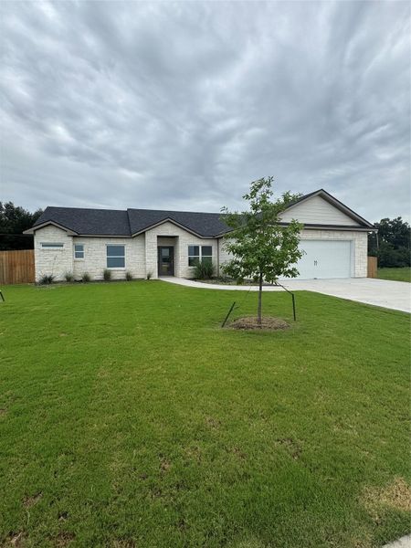 Front exterior of a new home in , Thorndale, TX, highlighting curb appeal (Image 23).