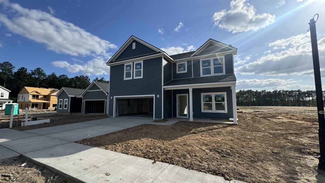 Front exterior of a new home in , Summerville, SC, highlighting curb appeal (Image 2). Front exterior of a new home in , Summerville, SC, highlighting curb appeal (Image 2).