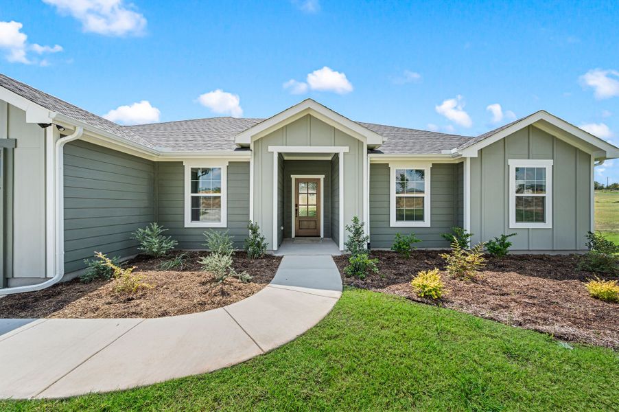 Front exterior of a new home in Gatlin Ranch, Springtown, TX, highlighting curb appeal (Image 18).