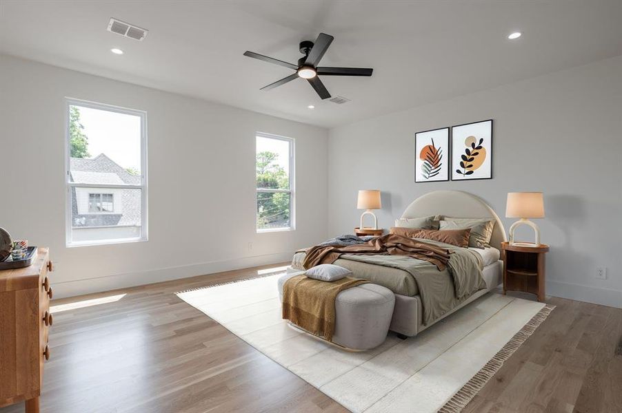 Bedroom featuring light wood-style floors, ceiling fan, and recessed lighting Bedroom featuring light wood-style floors, ceiling fan, and recessed lighting