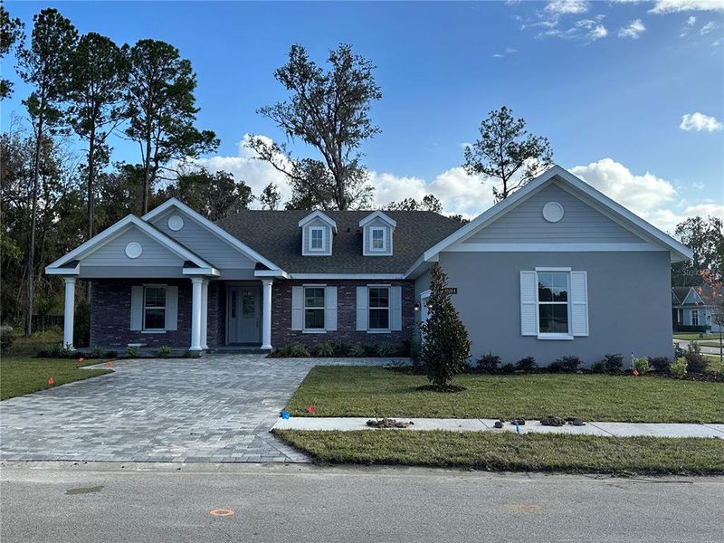 Front exterior of a new home in Southern Hills Plantation, Brooksville, FL, highlighting curb appeal (Image 2). Front exterior of a new home in Southern Hills Plantation, Brooksville, FL, highlighting curb appeal (Image 2).