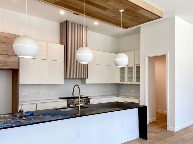 Two tone cabinets, oversized pendants, wood features, and a large walk-in pantry. (construction photos - professional photos upon completion) Two tone cabinets, oversized pendants, wood features, and a large walk-in pantry. (construction photos - professional photos upon completion)