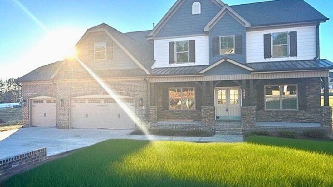 Representative exterior photo of a completed home built from the Lancaster by Keystone Homes NC in Preserve at Carriage Cove, Oak Ridge, NC (Image 29).