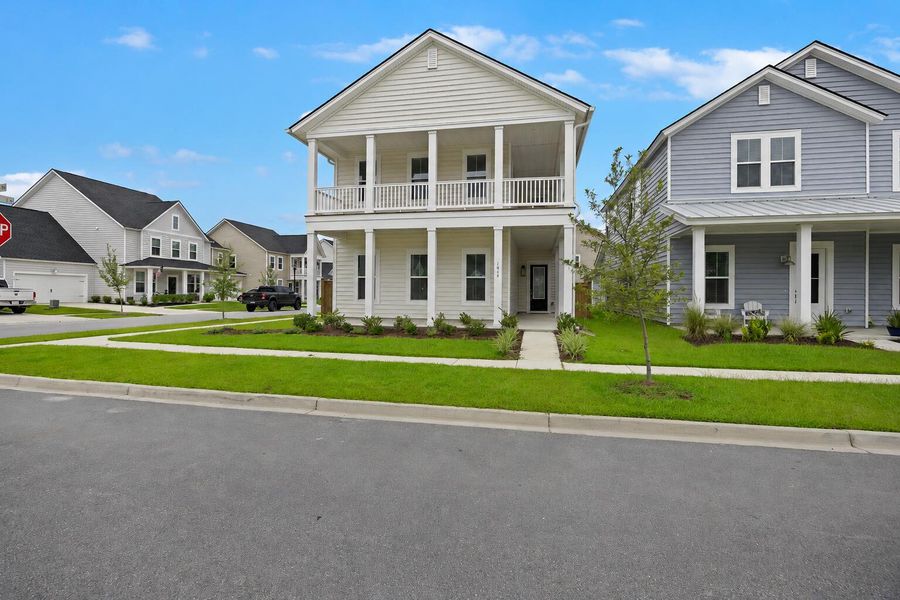 Front exterior of a new home in Sweetgrass at Summers Corner, Summerville, SC, highlighting curb appeal (Image 14). Front exterior of a new home in Sweetgrass at Summers Corner, Summerville, SC, highlighting curb appeal (Image 14).