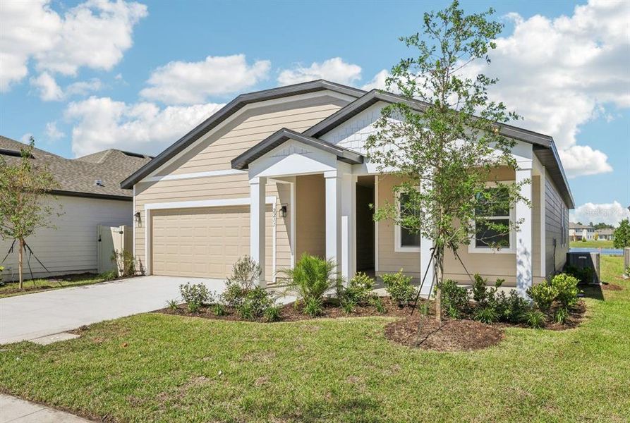 Front exterior of a new home in Ellington Traditional, St. Cloud, FL, highlighting curb appeal (Image 2). Front exterior of a new home in Ellington Traditional, St. Cloud, FL, highlighting curb appeal (Image 2).