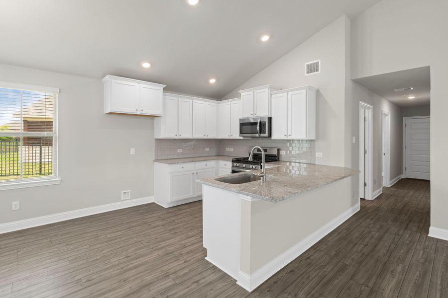 Furnished interior view inside a new home in Sunterra, Katy (Image 6).