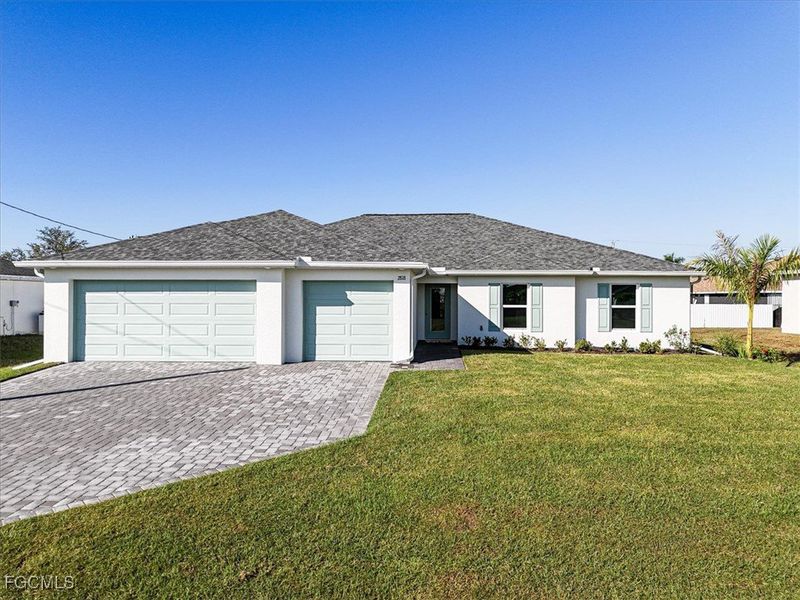 Front exterior of a new home in Cape Coral, Cape Coral, FL, highlighting curb appeal (Image 1). Front exterior of a new home in Cape Coral, Cape Coral, FL, highlighting curb appeal (Image 1).
