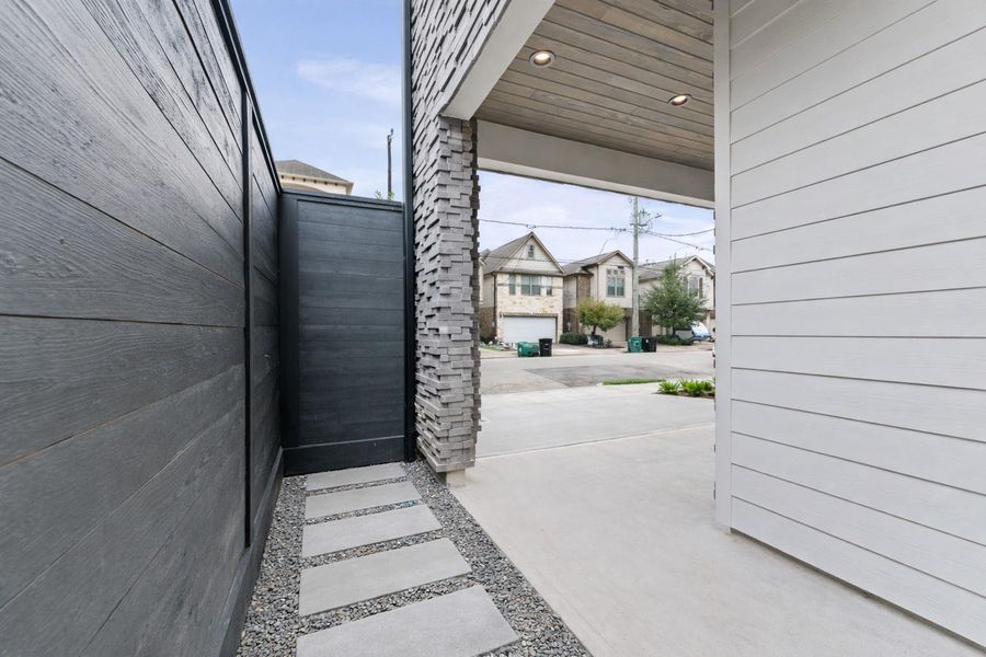 Private space for trash/recycles with sleek exterior finishes.