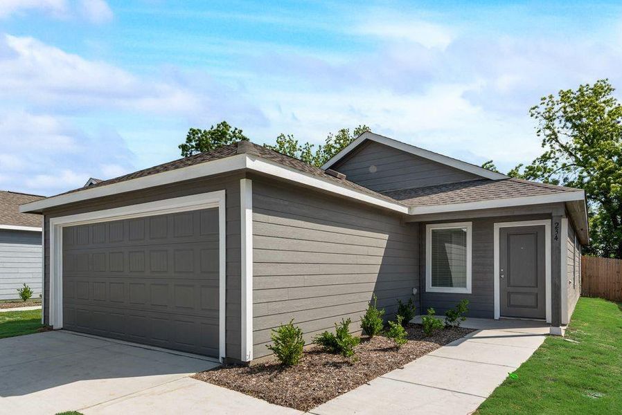 Front exterior of a new home in Cottonwood, Wilmer, TX, highlighting curb appeal (Image 14). Front exterior of a new home in Cottonwood, Wilmer, TX, highlighting curb appeal (Image 14).