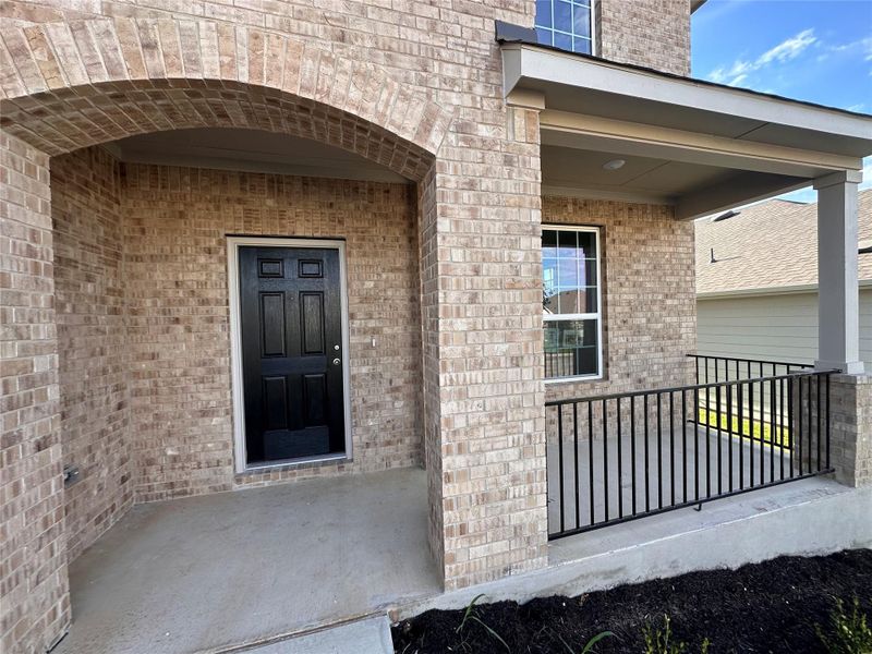Doorway to property with brick siding Doorway to property with brick siding