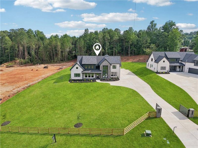 Front exterior of a new home in , Braselton, GA, highlighting curb appeal (Image 54).
